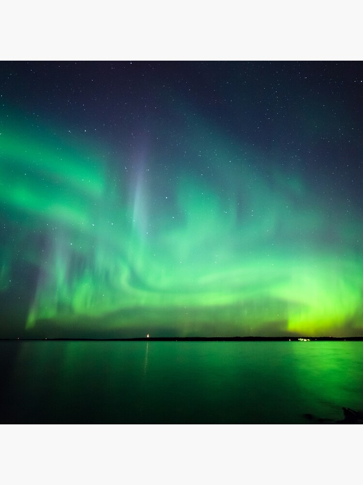 Northern lights over lake by Juhku