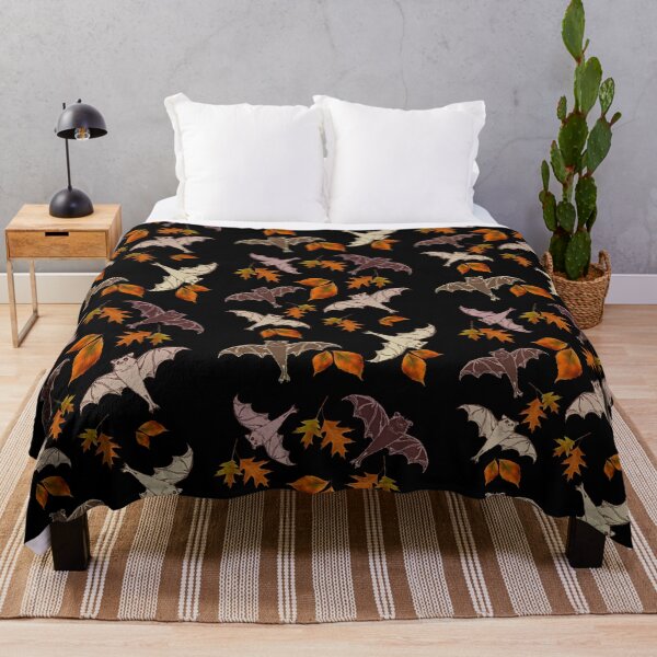 Item preview, cute brown flying bats from my drawing, frolicking among red-orange falling autumn leaves | repeating pattern on black | Halloween designed and sold by DigitalEurydice.