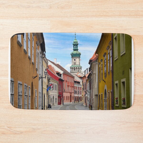 Item preview, Street with old buildings and Firewatch tower in Sopron Hungary designed and sold by goceris.
