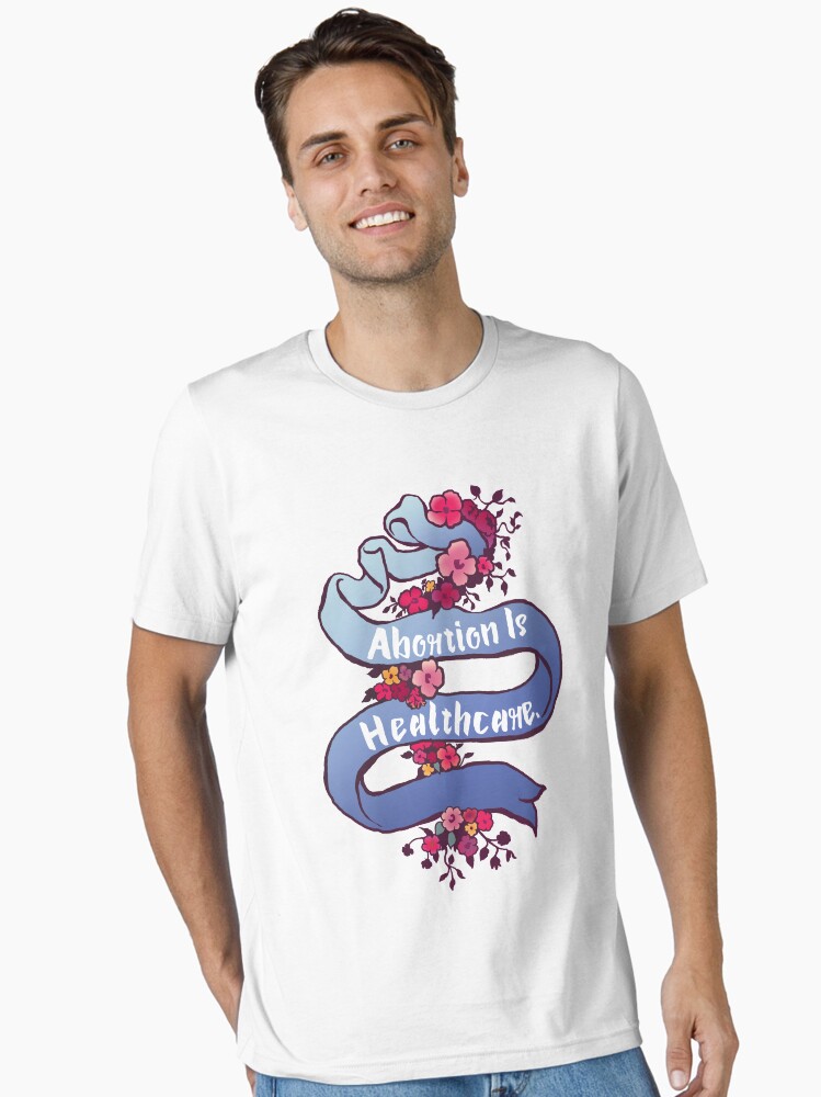 Thumbnail 1 of 7, Essential T-Shirt, Abortion Is Healthcare designed and sold by fabfeminist.
