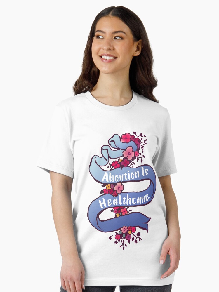 Thumbnail 2 of 7, Essential T-Shirt, Abortion Is Healthcare designed and sold by fabfeminist.