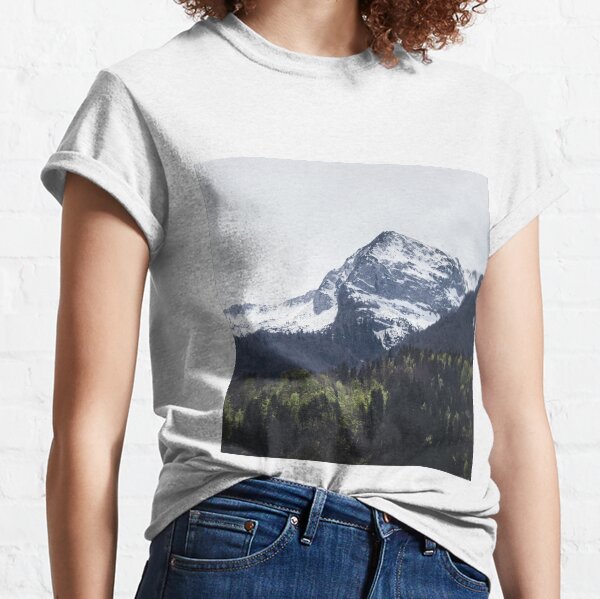 Winter and Spring - green trees and snowy mountains Classic T-Shirt
