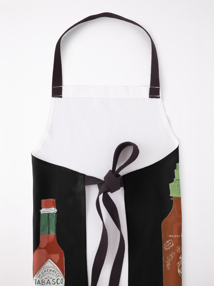 Alternate view of Spicy! Check out these hot sauces on black background Apron