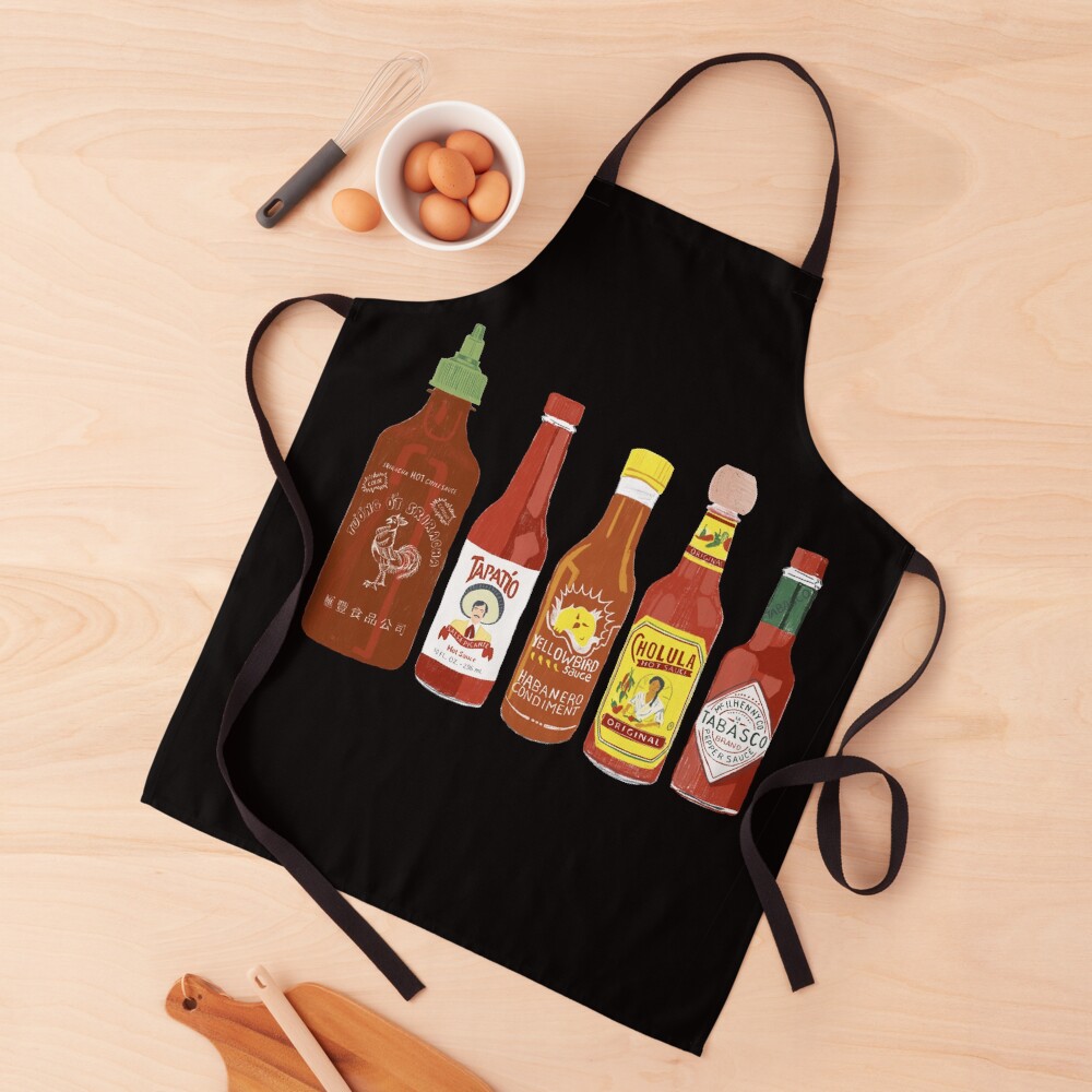 Spicy! Check out these hot sauces on black background Apron