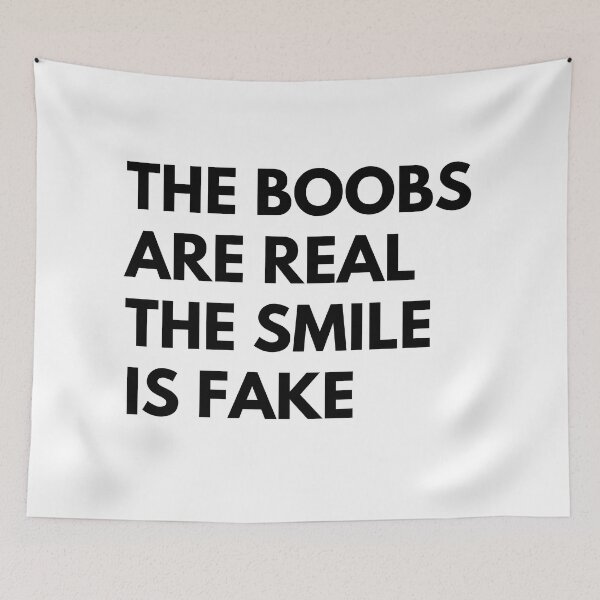 Item preview, The Boobs Are Real The Smile Is Fake. Funny Snarky NSFW Saying designed and sold by That Cheeky Tee.