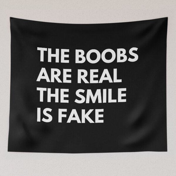 Item preview, The Boobs Are Real The Smile Is Fake. Funny Snarky NSFW Saying designed and sold by That Cheeky Tee.