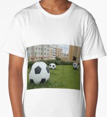 soccer balls on the green lawn Long T-Shirt