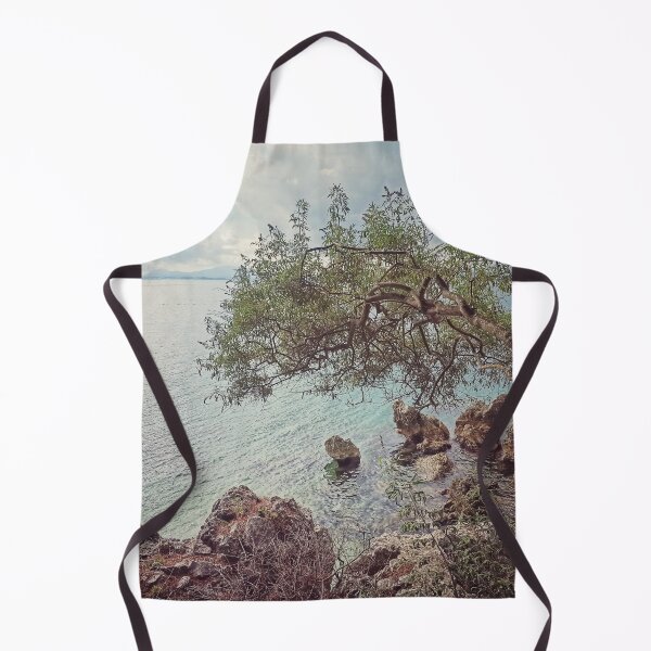 Item preview, SINGLE OLIVE TREE OVERHANGS THE SEA GREECE designed and sold by nickbrayimages.