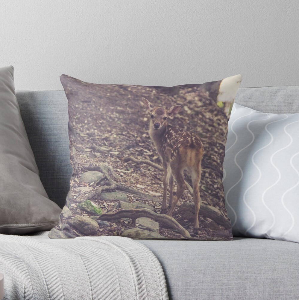 A fawn discovering the forest Throw Pillow