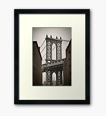Empire State Building through arch of Manhattan Bridge Framed Print