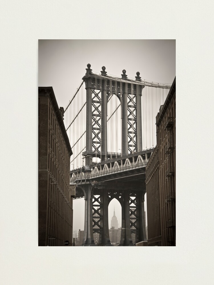 Alternate view of Empire State Building through arch of Manhattan Bridge Photographic Print