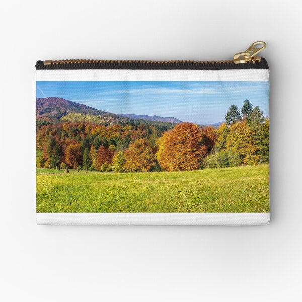 trees on autumn meadow in mountains Zipper Pouch