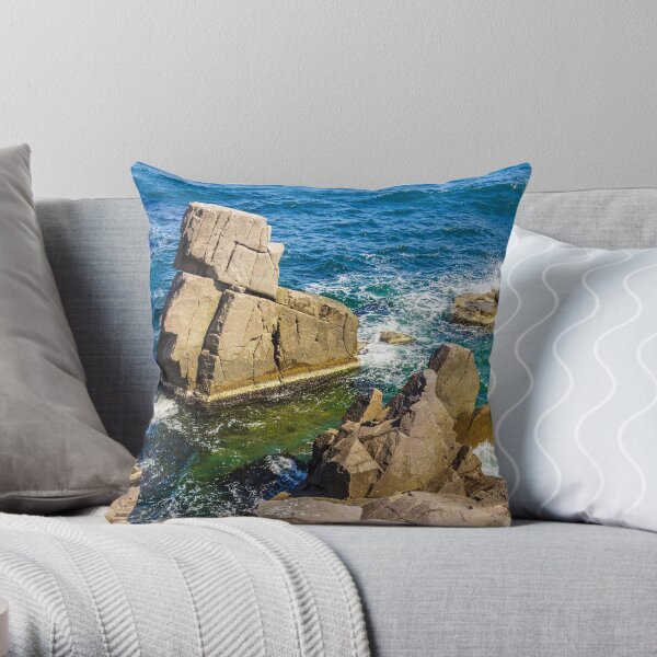 sea wave breaks about rocky shore Throw Pillow