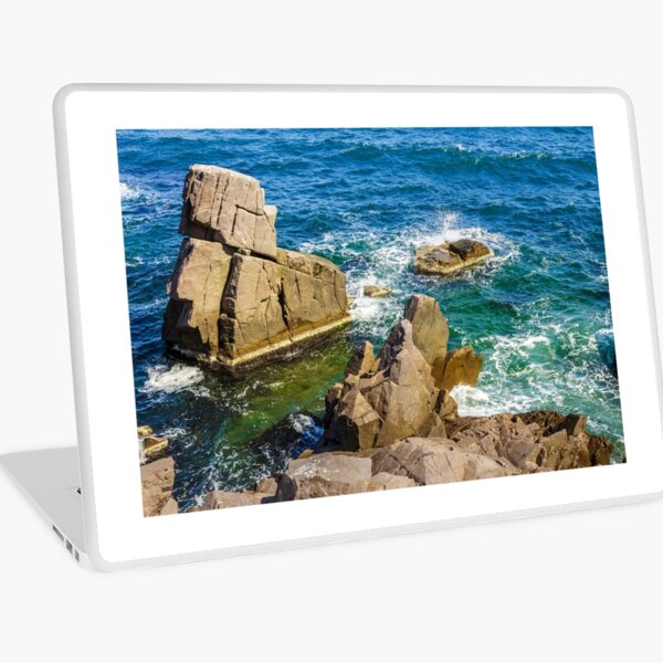 sea wave breaks about rocky shore Laptop Skin