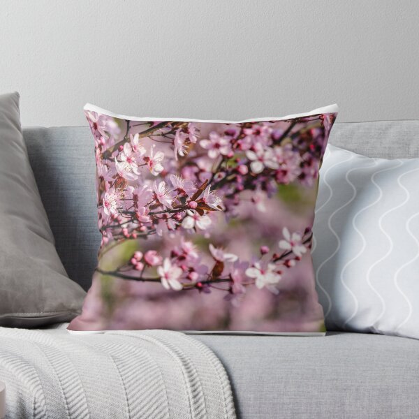 flowers of apple tree on a blur background Throw Pillow