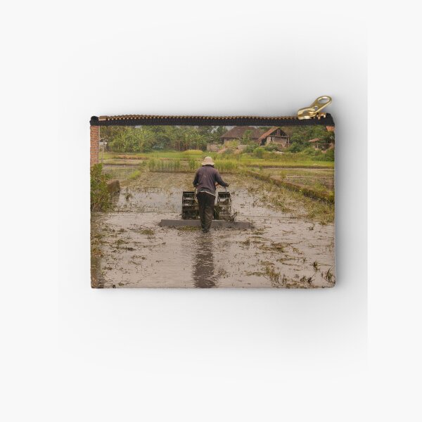 Item preview, A man in backside view plows a village rice field. designed and sold by kall3bu.