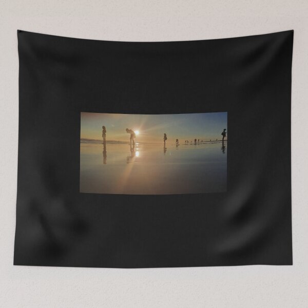 Item preview, Silhouetted people in a row on a sand beach. designed and sold by kall3bu.