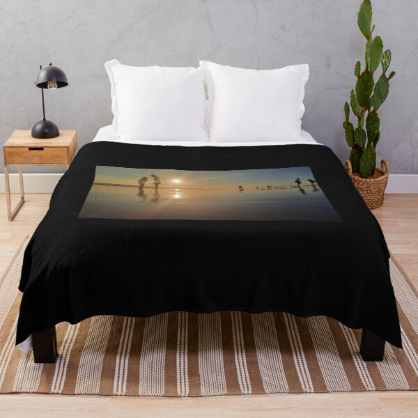 Item preview, Silhouetted people in a row on a sand beach. designed and sold by kall3bu.
