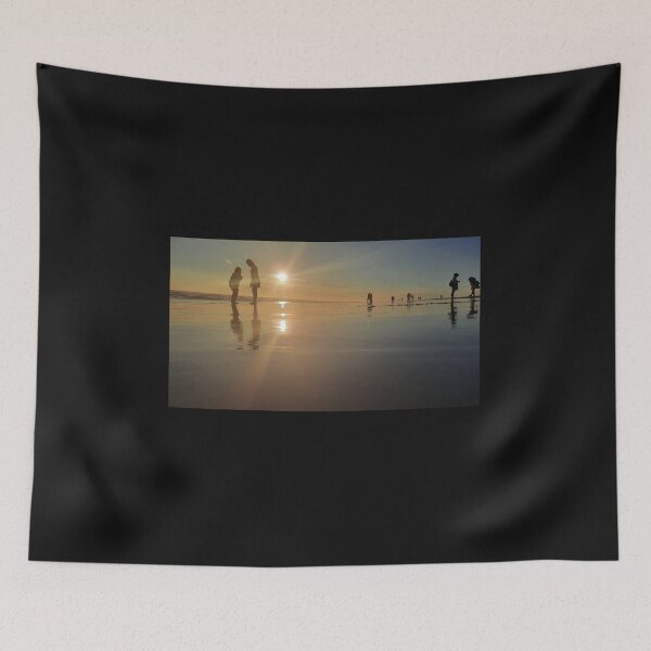 Item preview, Silhouetted people in a row on a sand beach. designed and sold by kall3bu.