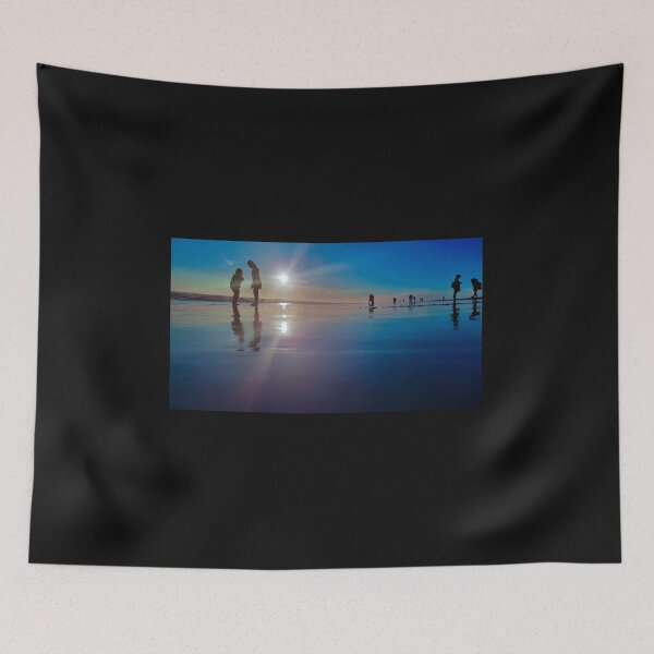 Item preview, Silhouetted people in a row on a sand beach. designed and sold by kall3bu.