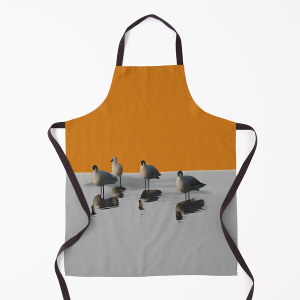 Item preview, Four water birds on a grey beach with orange sunset background. Orange background designed and sold by janesg.