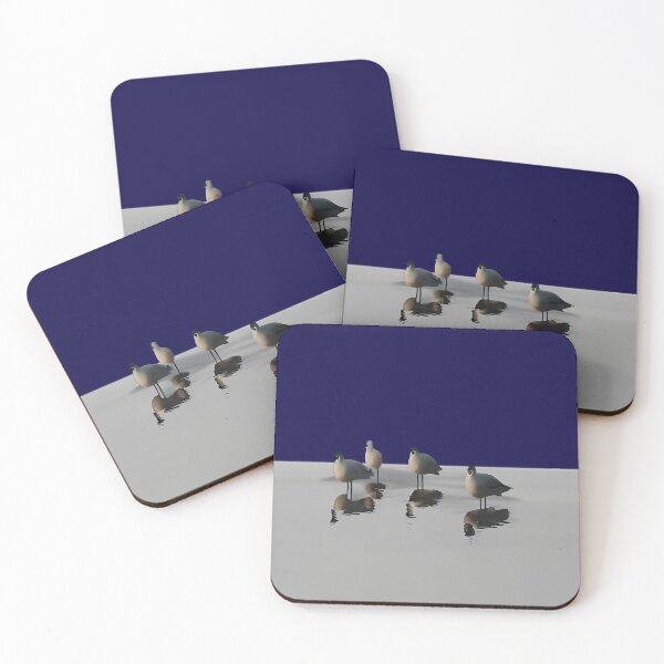 Item preview, Four water birds on a grey beach. Blue background designed and sold by janesg.