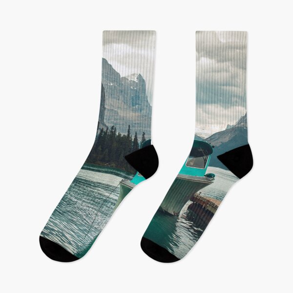 Item preview, Boat at Maligne Lake on a Cloudy Day, Jasper National Park, Alberta, Canada | Hall of the gods - Tall Mountains Surrounding Blue Lake designed and sold by BackpackTravel.