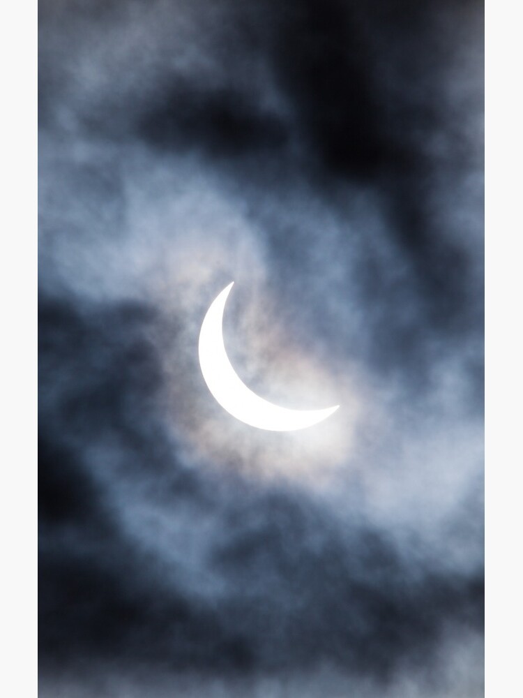 Partial solar eclipse through clouds by Juhku