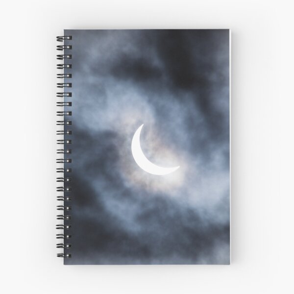 Item preview, Partial solar eclipse through clouds designed and sold by Juhku.