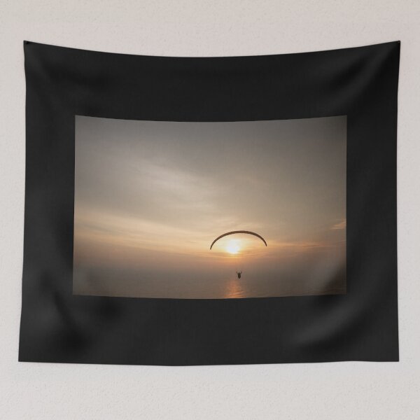 Item preview, Paragliding over the ocean while golden sunset designed and sold by kall3bu.