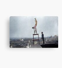 Daredevil John "Jammie" Reynolds performing acrobatic and balancing acts on high cornice above 9th street, N.W. - 1917 Canvas Print