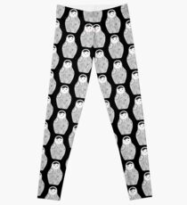 Cute doll matrioshka Babushka on black background Leggings