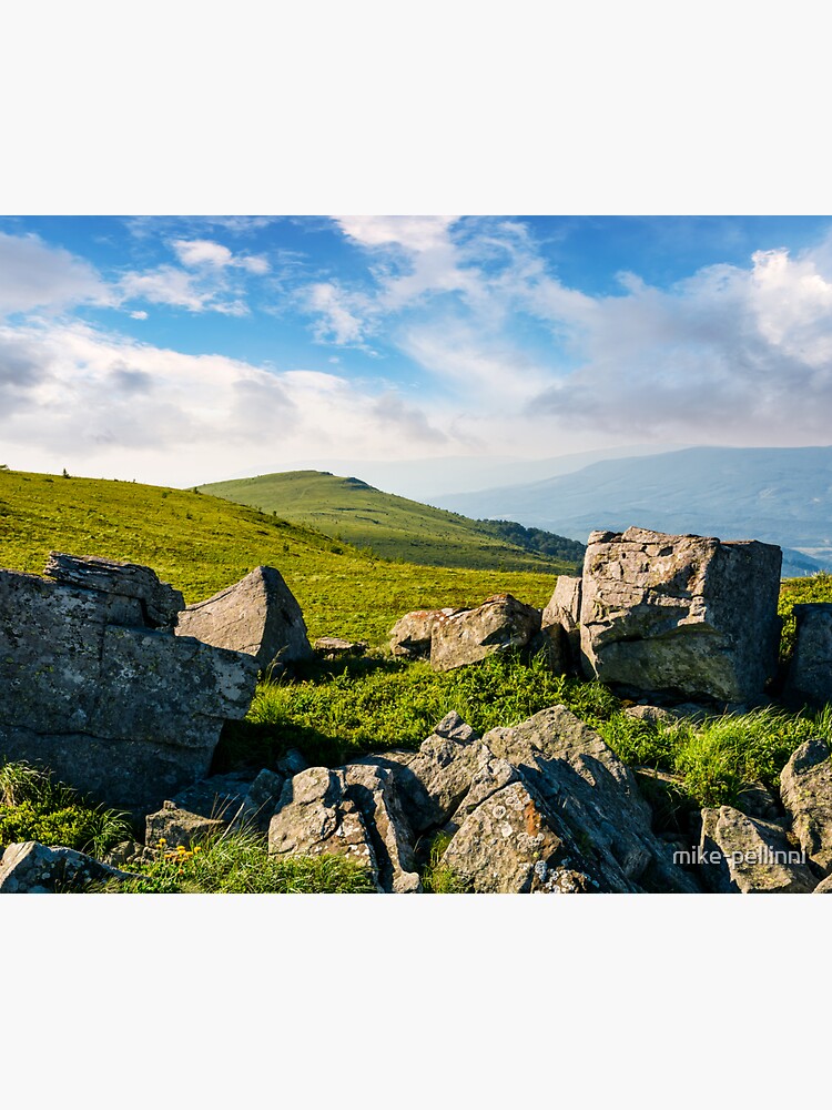 Thumbnail 3 of 3, Sticker, huge boulders on a grassy hillside at sunrise designed and sold by mike-pellinni.