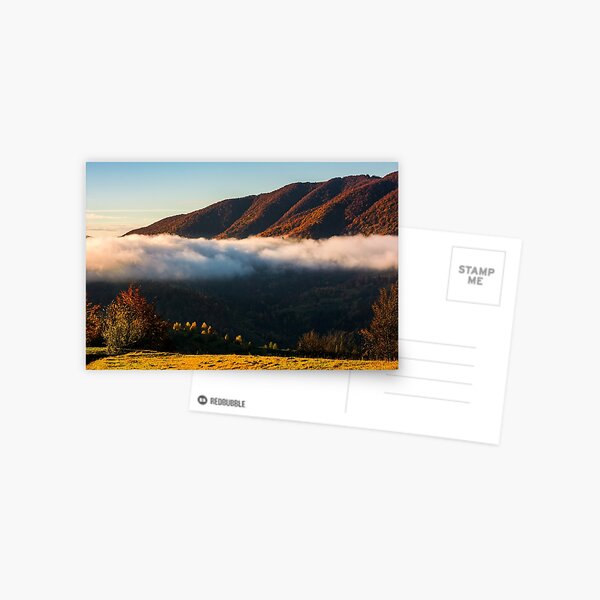 cloud rising above the forest in autumn mountains Postcard