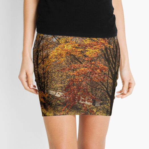 forest in golden brown foliage on sunny day Mini Skirt