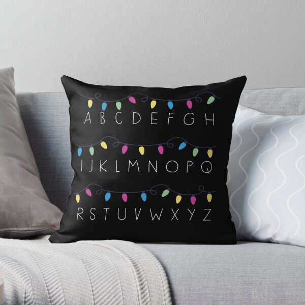 Étranges lumières sur le mur Coussin