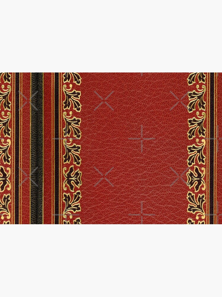 Red embossed leather book cover with gold inlay border design