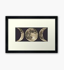 The triple moon Framed Print