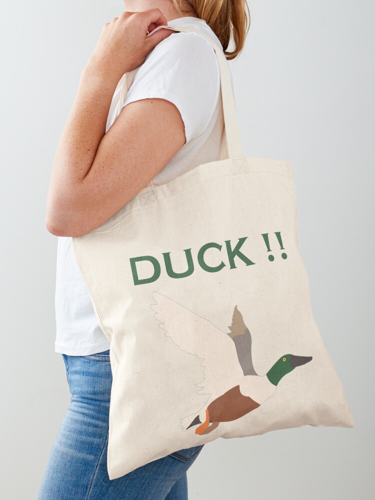 Flying duck with the word DUCK Tote Bag
