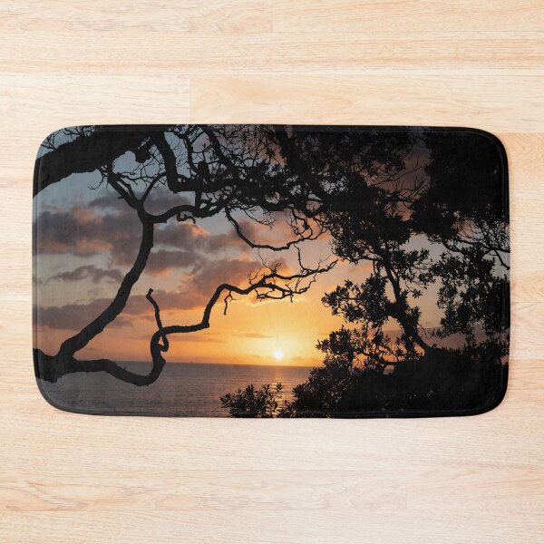 Item preview, Sunrise over coast framed by silhouette foliage of pohutukawa tree on edge of slope. designed and sold by Brian Scantlebury.