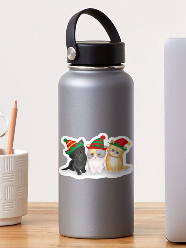 Thumbnail 1 of 3, Sticker, Cute Kittens Wearing Christmas Hats designed and sold by leopardynonsens.