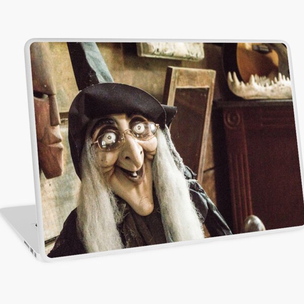 Vintage witch closeup log house Laptop Skin