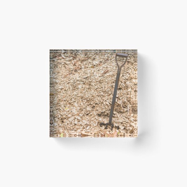 Item preview, Pile of sawdust wood chips background farm with metal rusty manure fork on left designed and sold by Nupu.