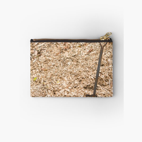 Item preview, Pile of sawdust wood chips background farm with metal rusty manure fork on left designed and sold by Nupu.
