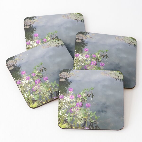 Item preview, Clouds reflected on the surface of a pond with flowering plants. designed and sold by claireseyeview.