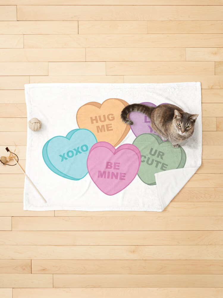 Valentine candy hearts have puppy and kitty love this year