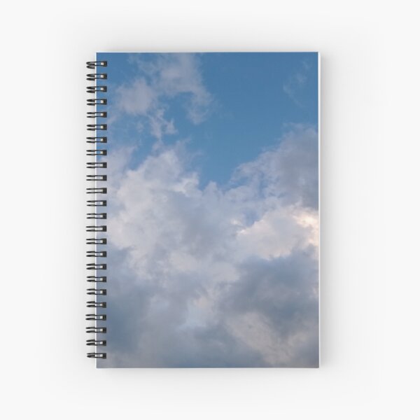 Cute puffy small white clouds on a sunny aqua blue sky Water Bottle