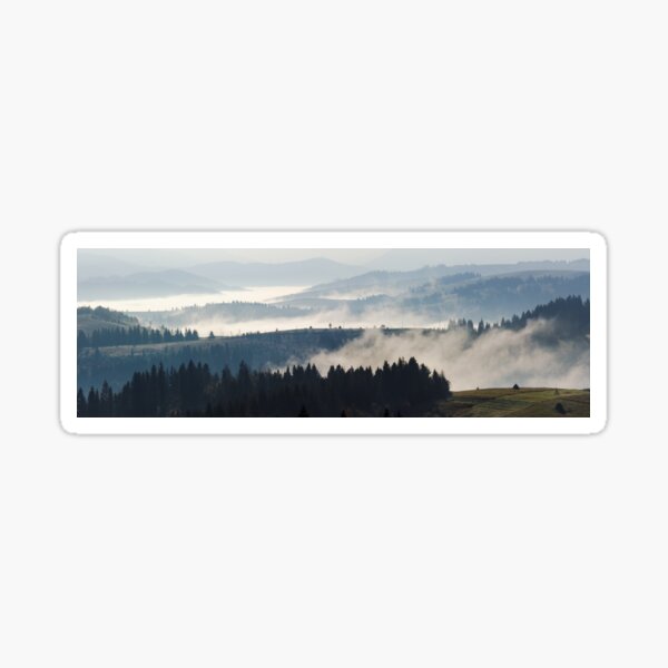 cold fog on hot sunrise in mountains Sticker