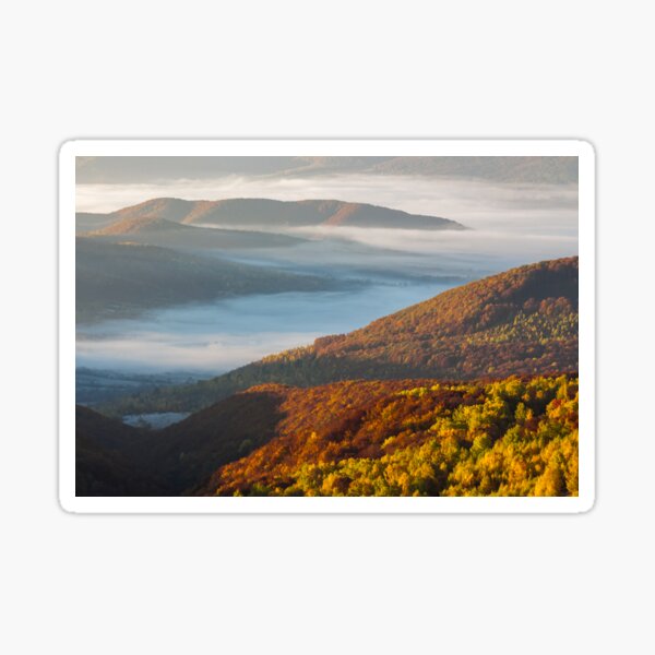 cold fog on hot sunrise in mountains Sticker