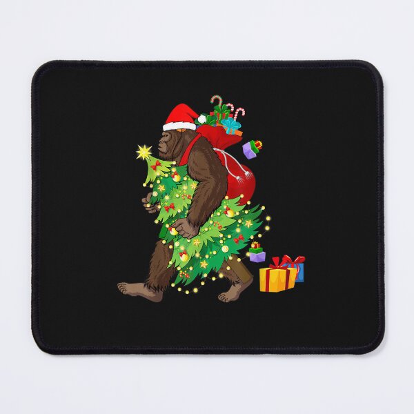 Item preview, Bigfoot Squatching Through the Snow Christmas Tree Sasquatch T-Shirt designed and sold by Blue-Rechard.